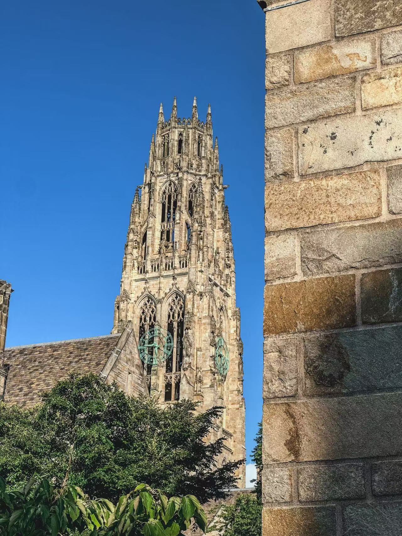 Gothic stone tower against a blue sky